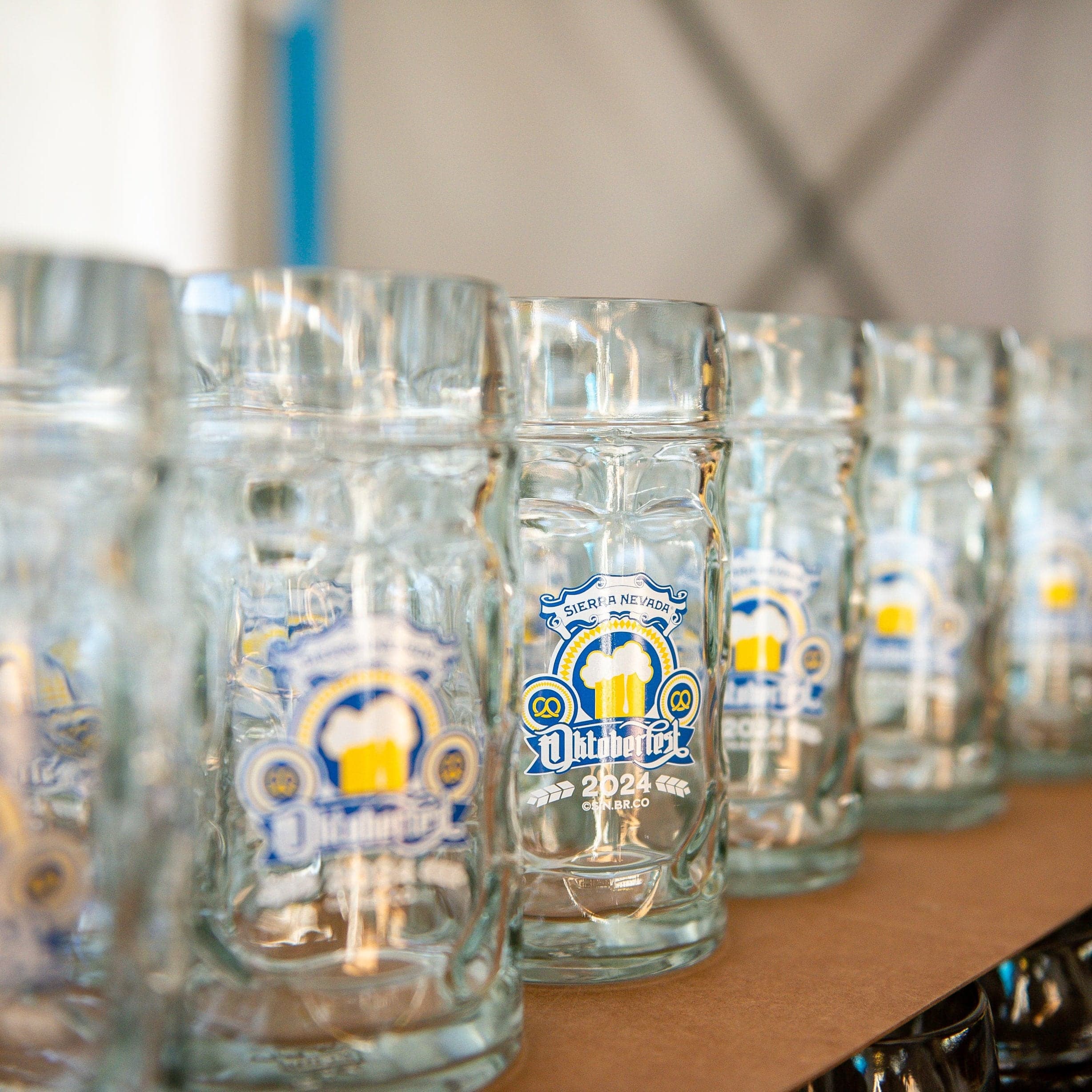 A row of 2024 Oktoberfest glass steins