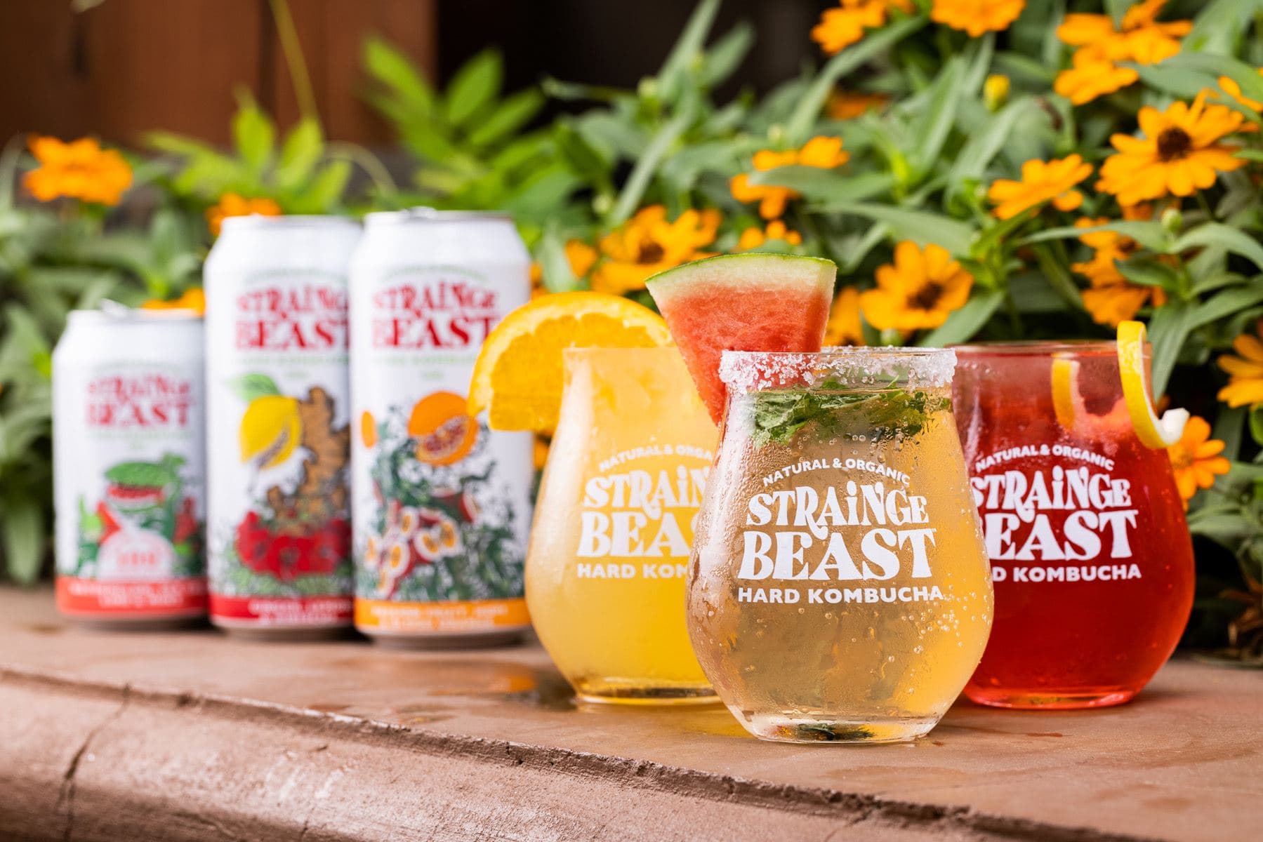 Three Strainge Beast flavors in glasses topped with garnishes