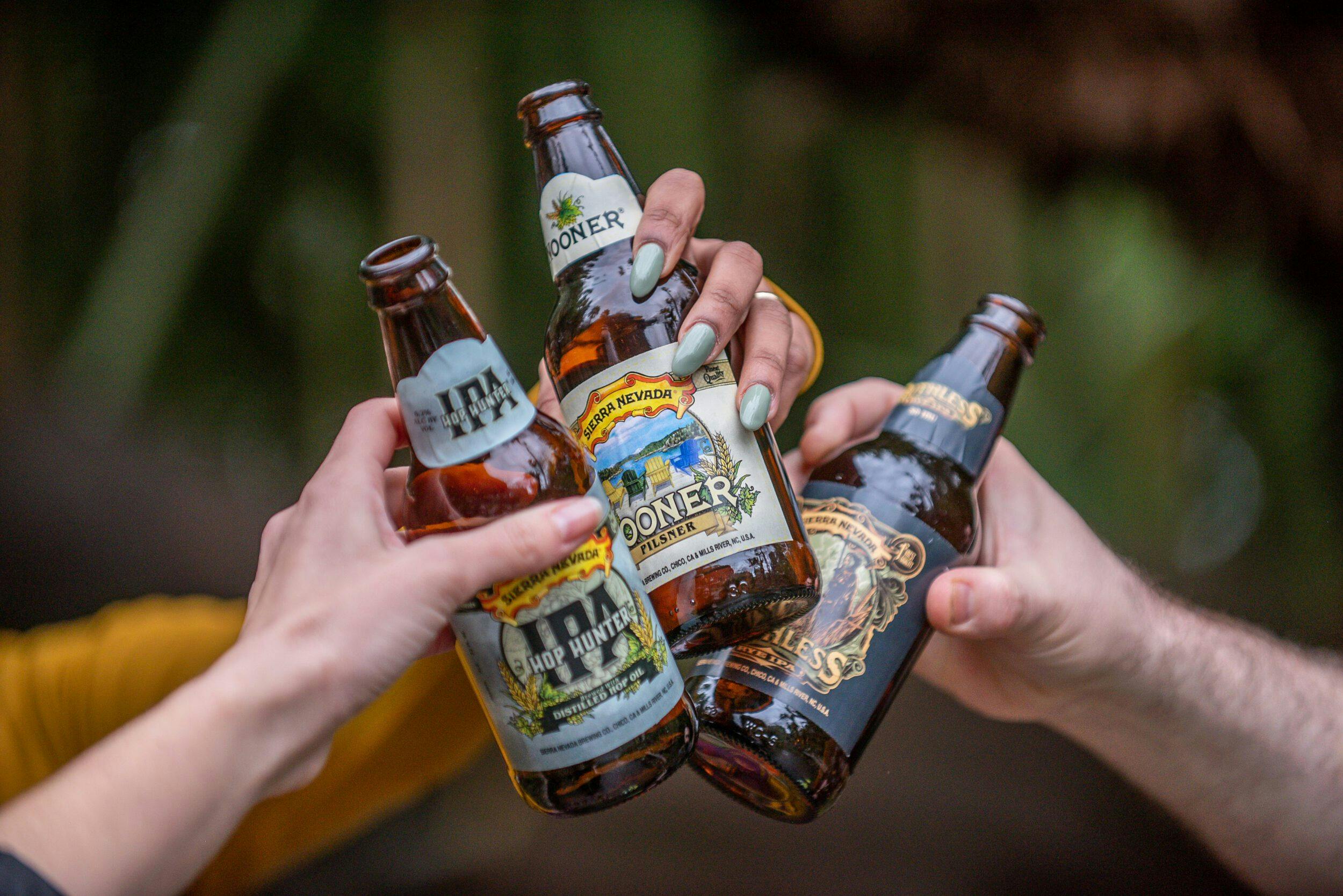 Friends relaxing with Fan Favorites beer outside