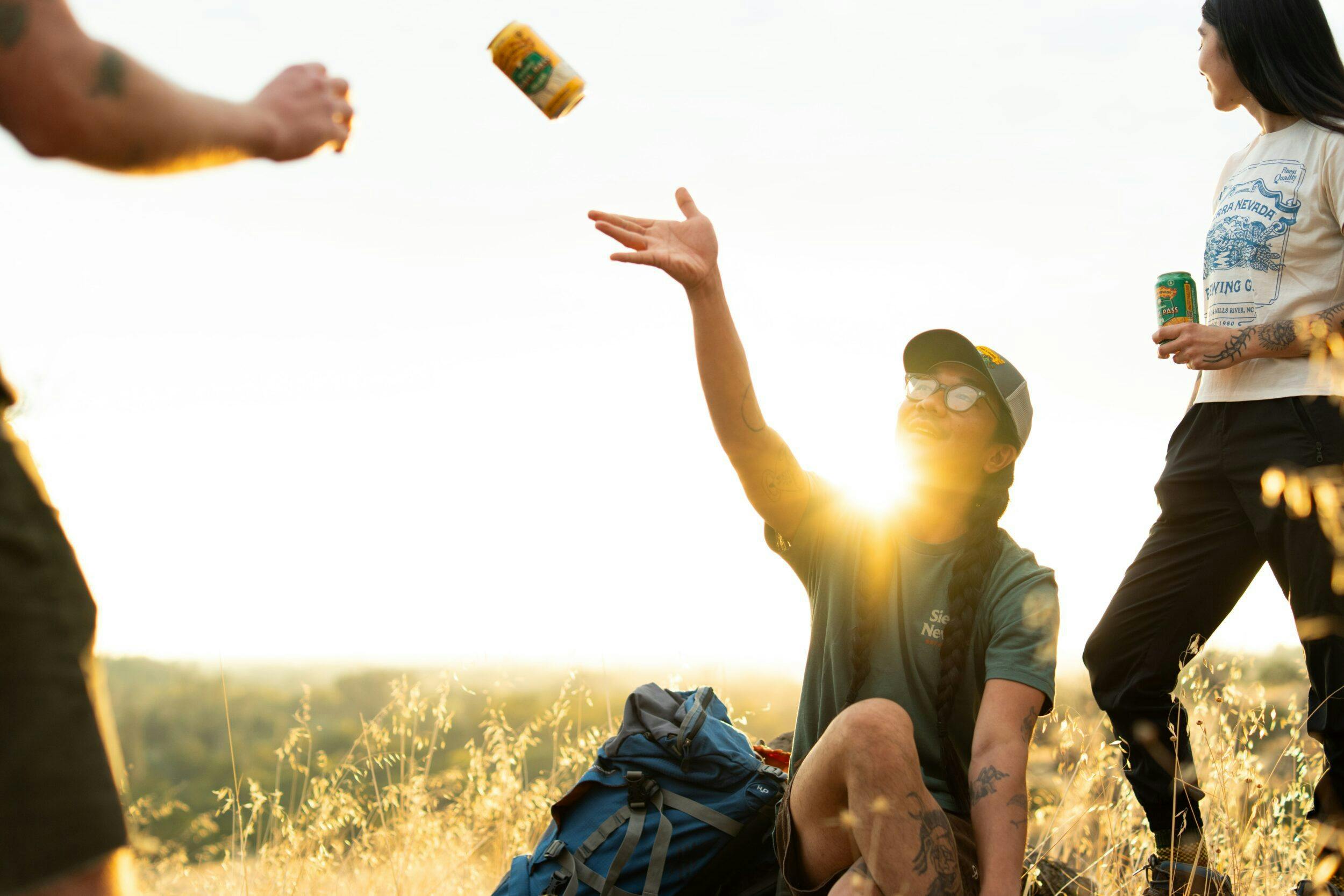 Trail Pass Golden can being tossed into air